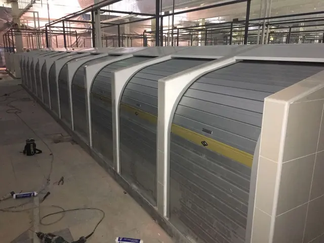 Curved aluminium roller shutter kiosks
