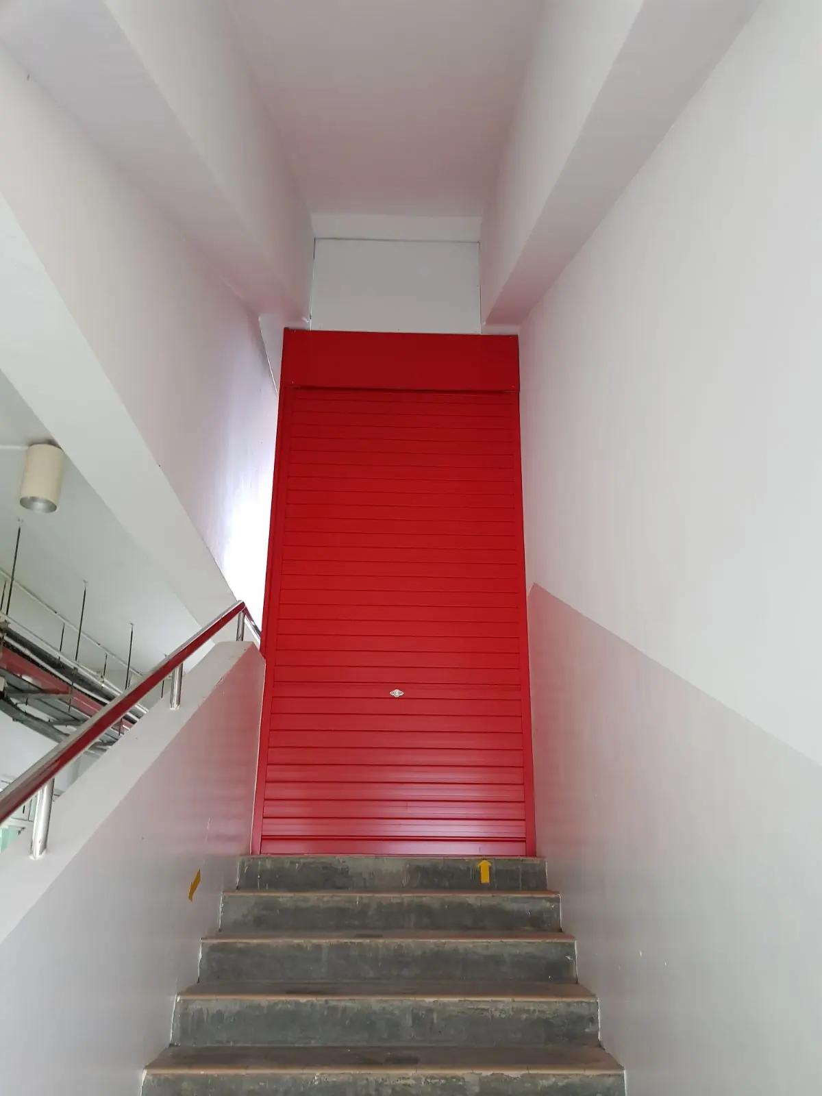 Red aluminium roller shutter fabricated by Yong Quan