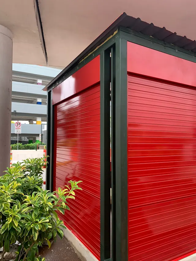 Red roller shutter on an outdoor kiosk