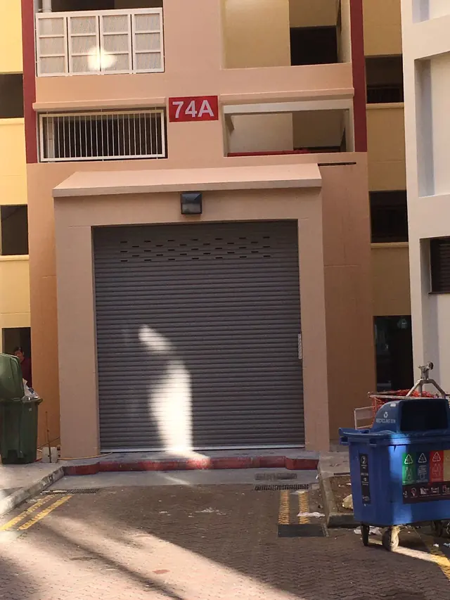Grey motorised roller door at a residential block