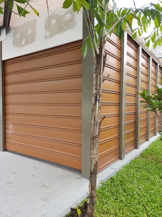 Woodgrain-finish roller door on a landed home