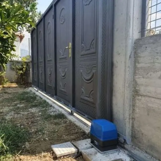 Sliding gate operator on a residential gate